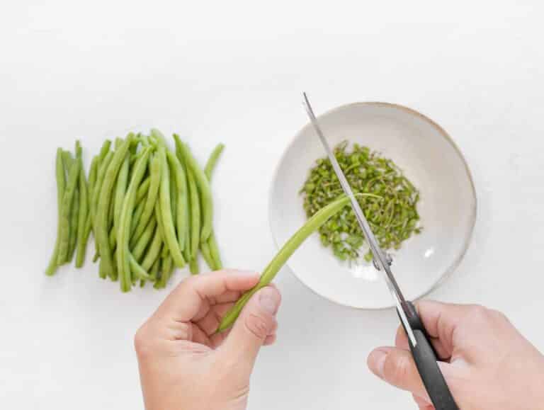 trimming green beans with scissors