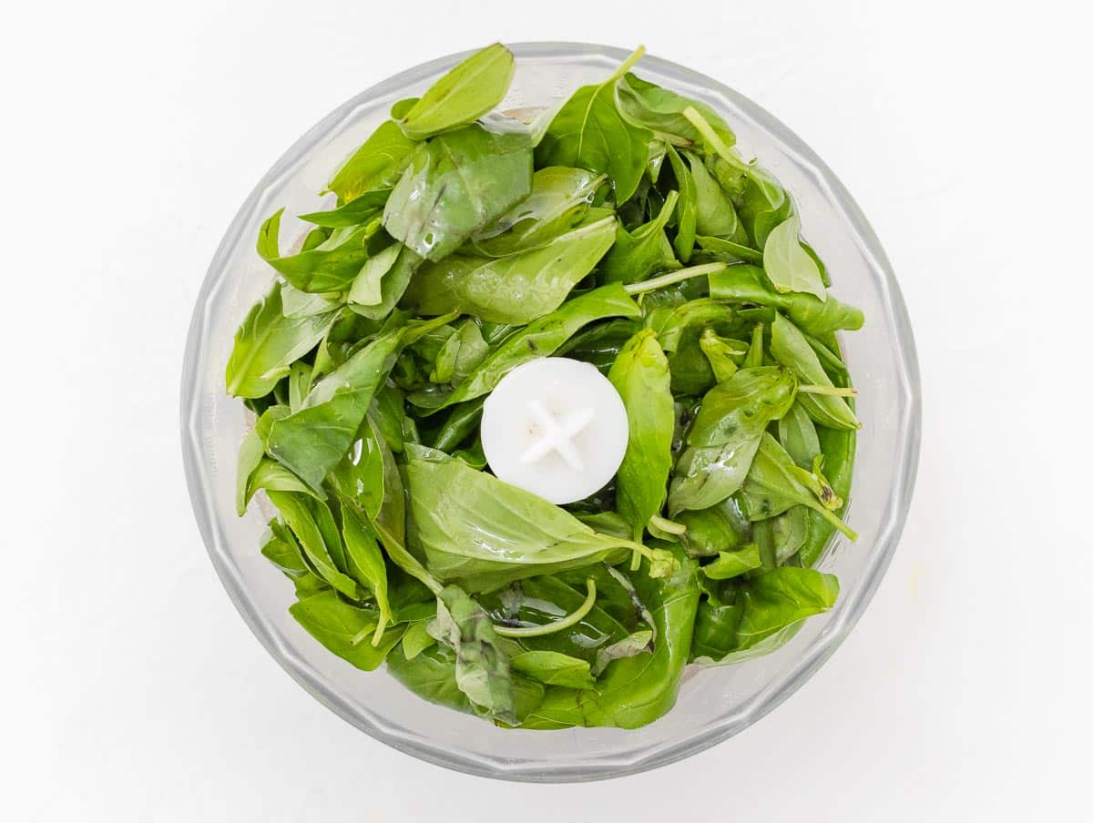 basil leaves in the food processor