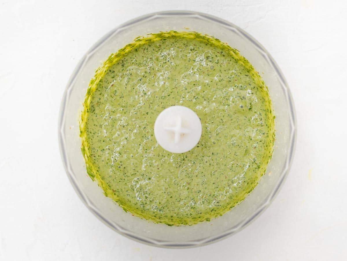 vegan basil pesto still in a food processor