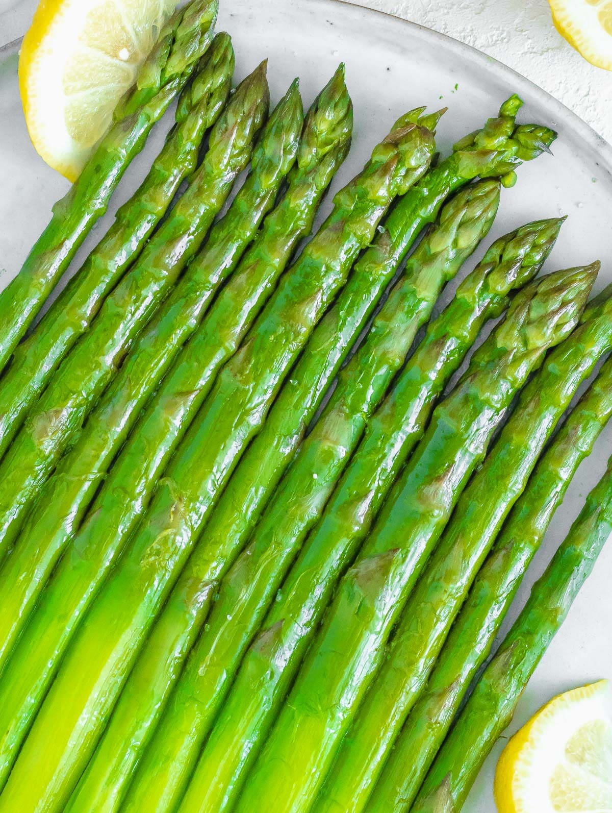 boiled asparagus served with lemon 