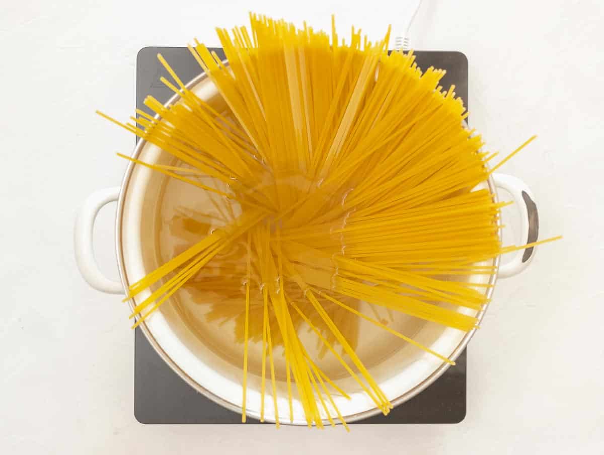 spaghetti pasta boiling in a large pot