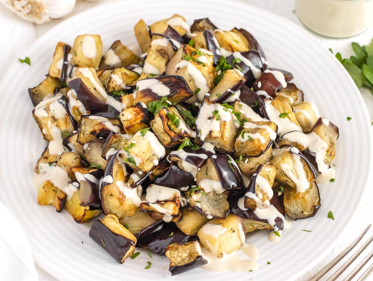 Air fryer eggplant with tahini sauce and parsley