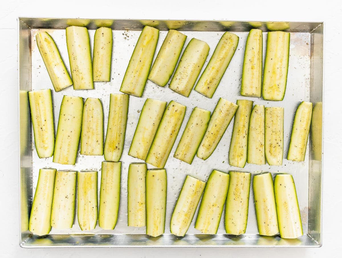 zucchini slices arranged on a baking tray