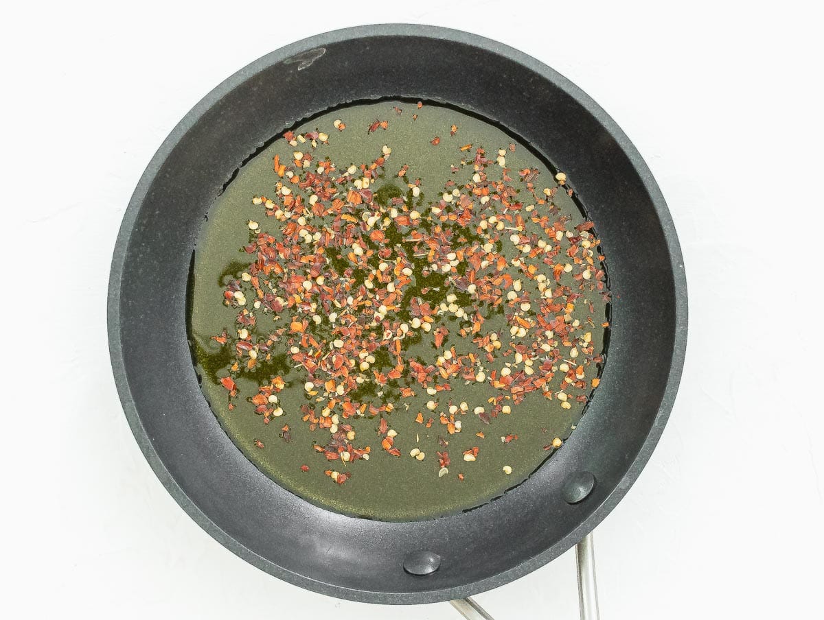 red pepper flakes and olive oil in a skillet