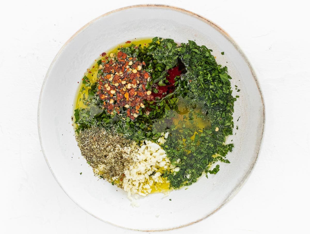 ingredients for chimichurri in a bowl