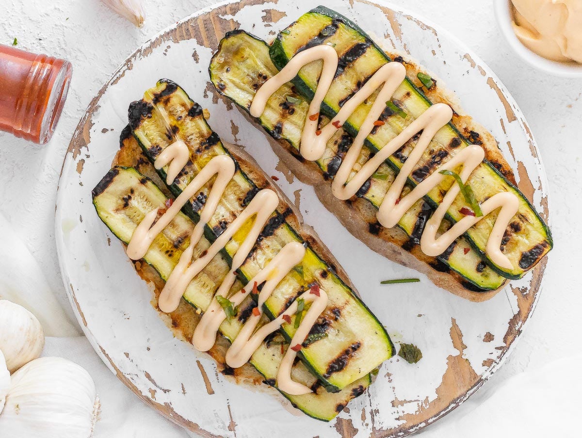grilled zucchini on toasted bread with chipotle sauce on top