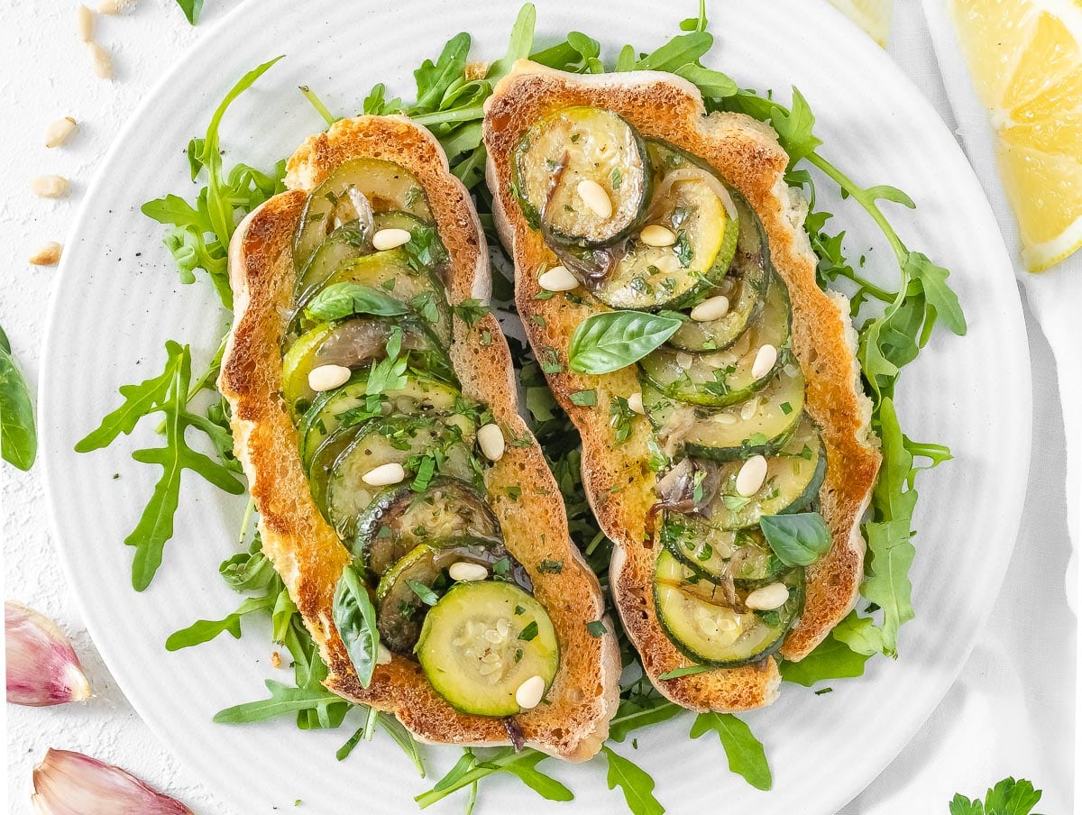 bruschetta with fried zucchini, pine nuts, and basil