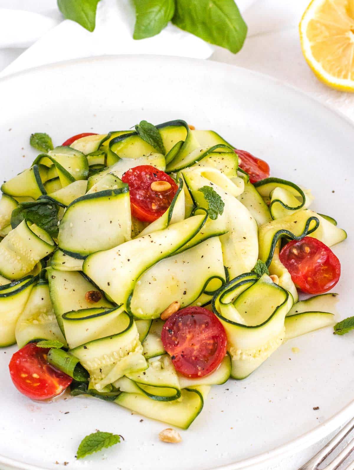 zucchini salad with cherry tomatoes and toasted pine nuts