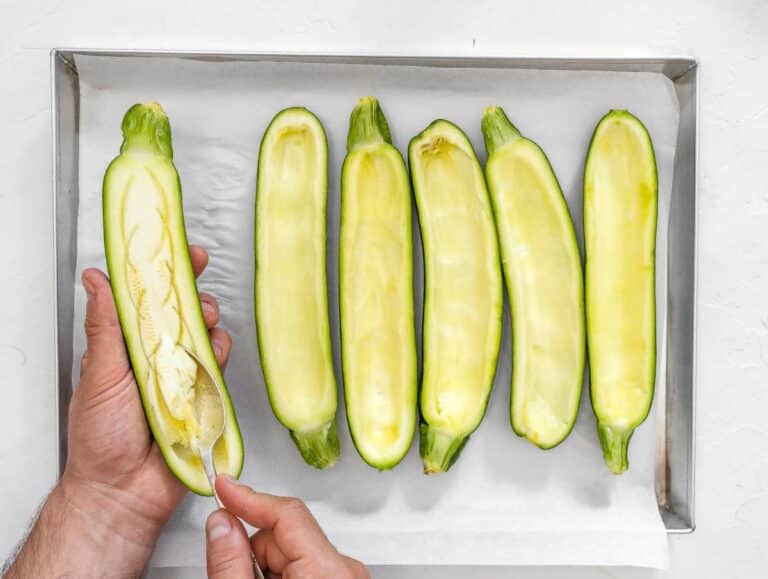 removing the zucchini flesh with a spoon