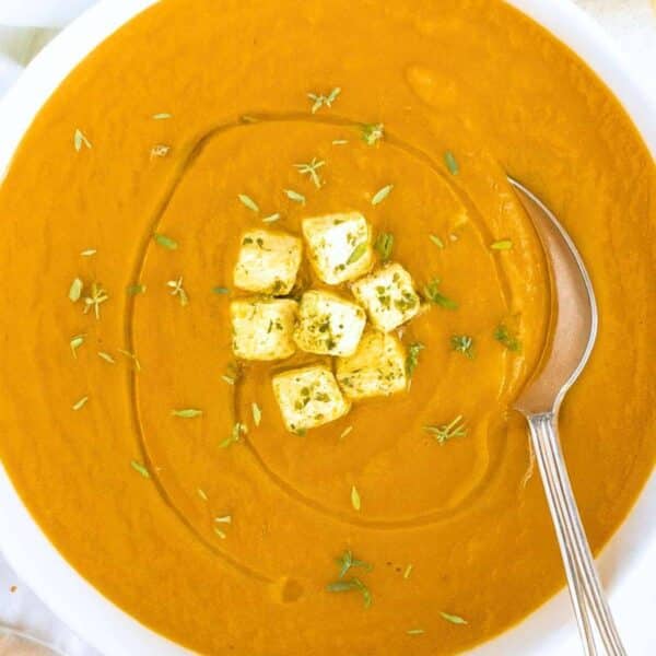 Creamy Mediterranean eggplant soup served in a bowl with olive oil drizzle and feta.