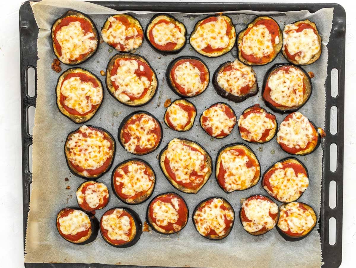 melted cheese on eggplant pizzas
