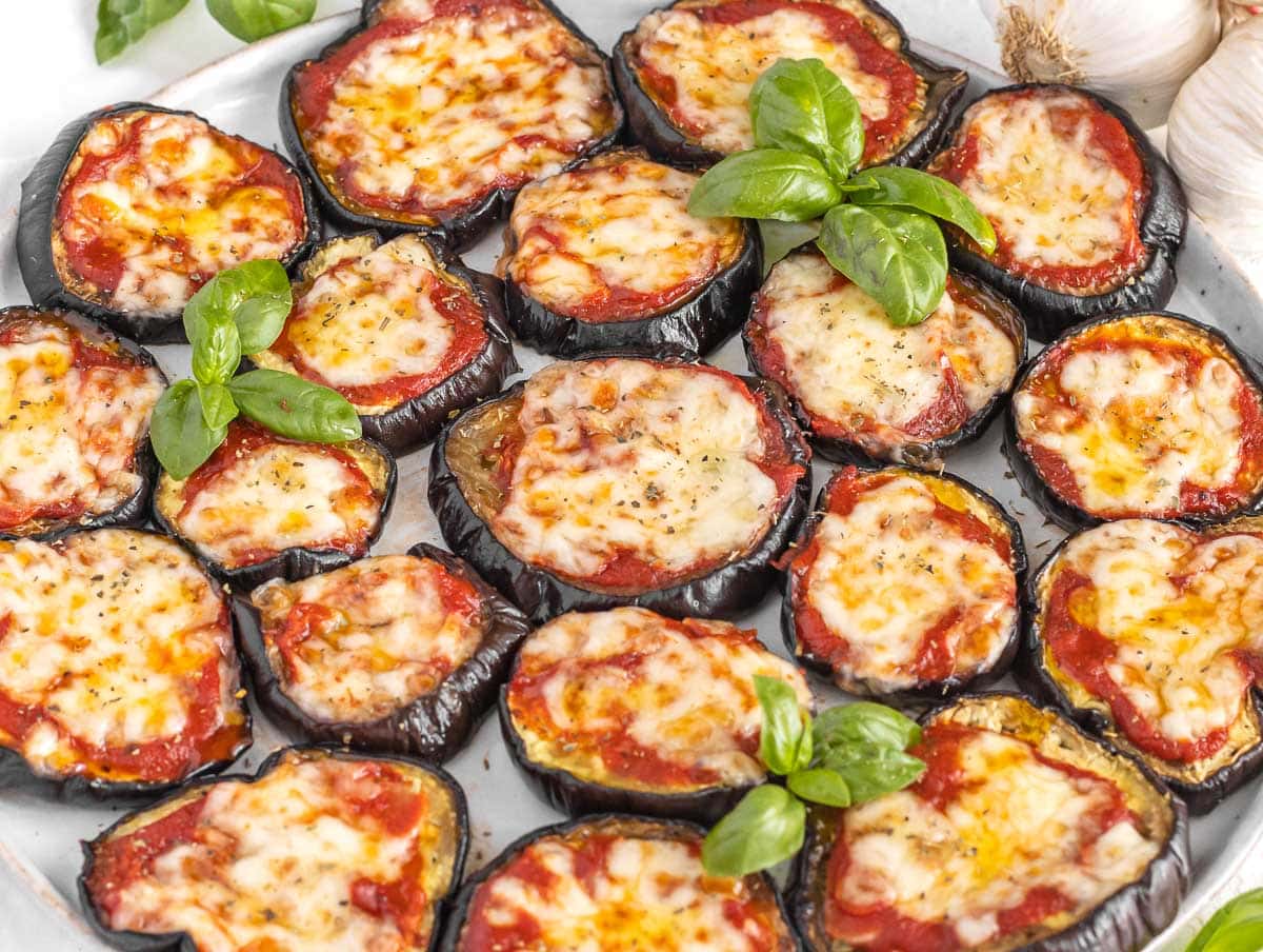 eggplant pizza with tomato sauce, melty cheese, and basil