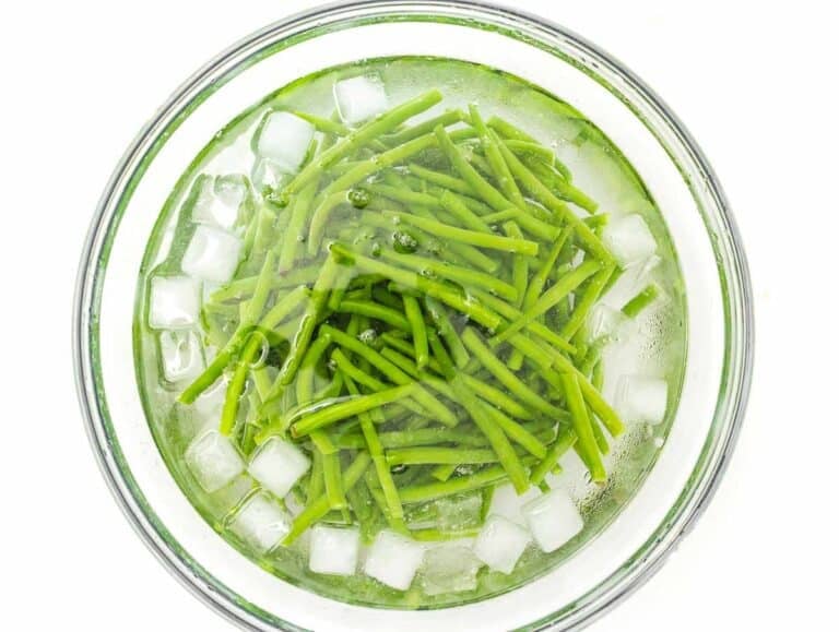 large bowl with iced water and blanched green beans
