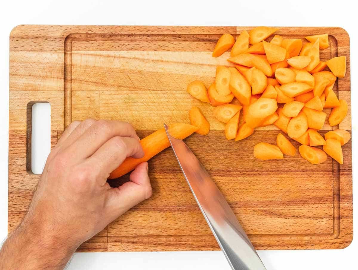 chopping carrots into small pieces