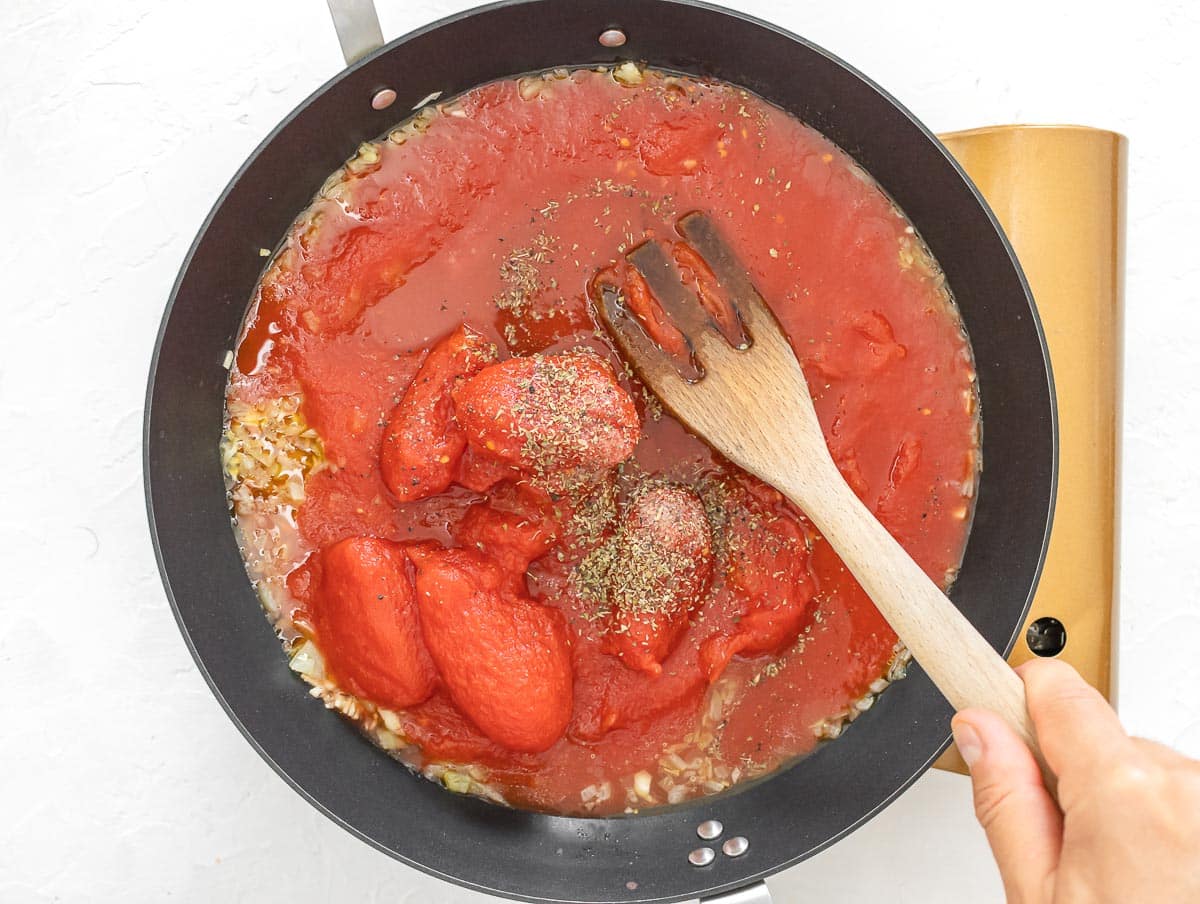 canned whole peeled tomatoes in the pan
