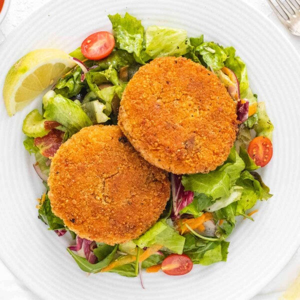 crispy risotto cakes on a side salad