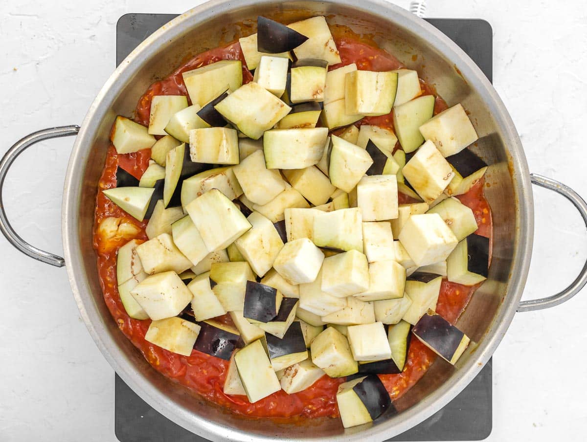 eggplant cubes added to the pan