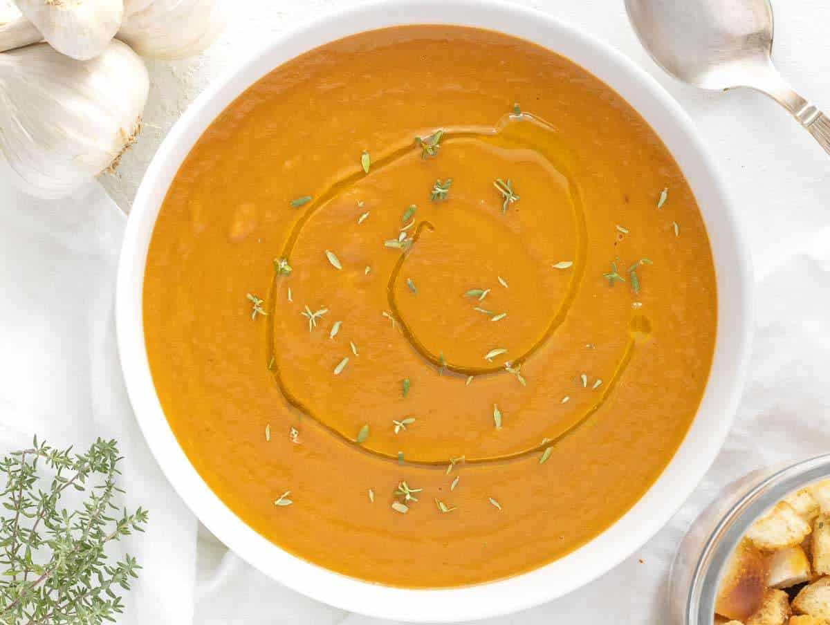 Step 4 – Serving Mediterranean eggplant soup with a drizzle of olive oil and croutons.