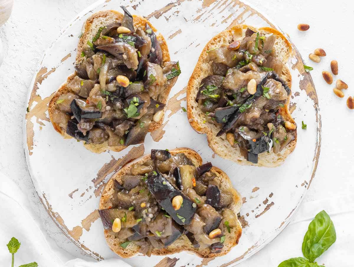 sweet and sour eggplant on toasted bread