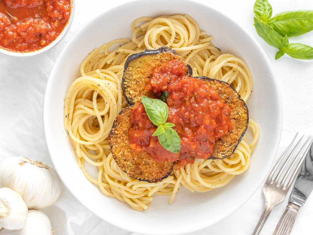 breaded eggplant on spaghetti with marinara sauce