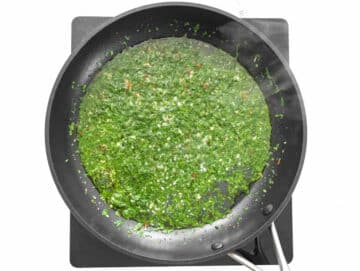 frying the parsley with oil and garlic