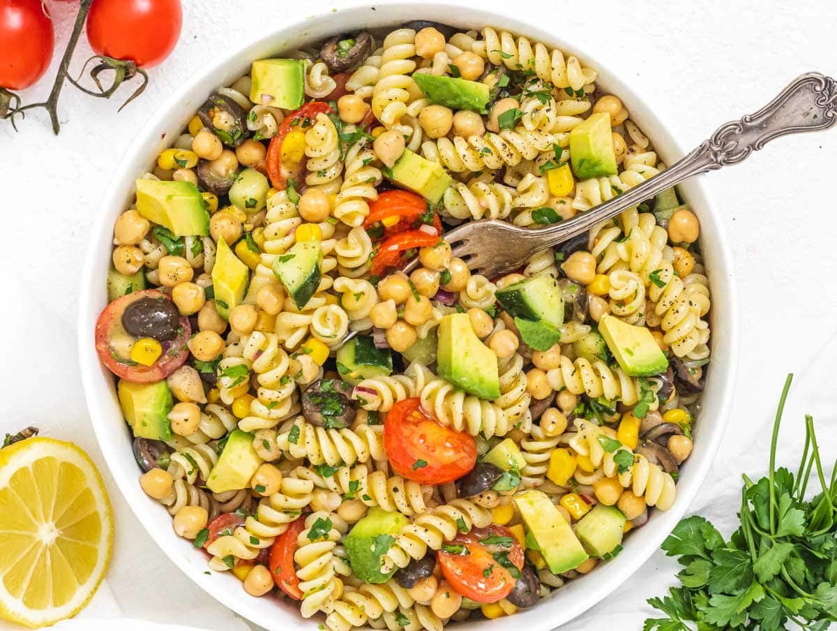 chickpea pasta salad with a fork in a bowl
