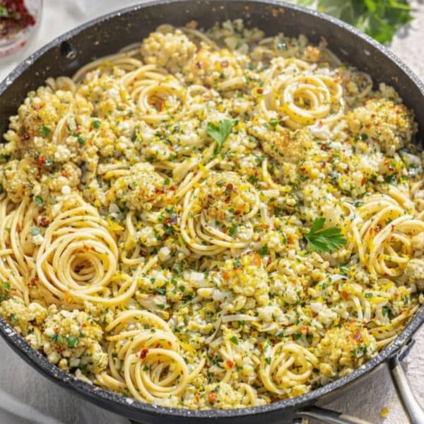 Easy cauliflower pasta with roasted cauliflower garlic and lemon served Mediterranean style.