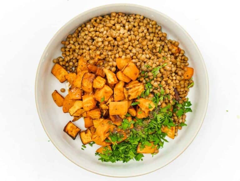 tossing lentil salad with cumin dressing