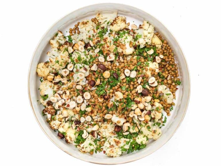 large bowl with all ingredients for cauliflower lentil salad