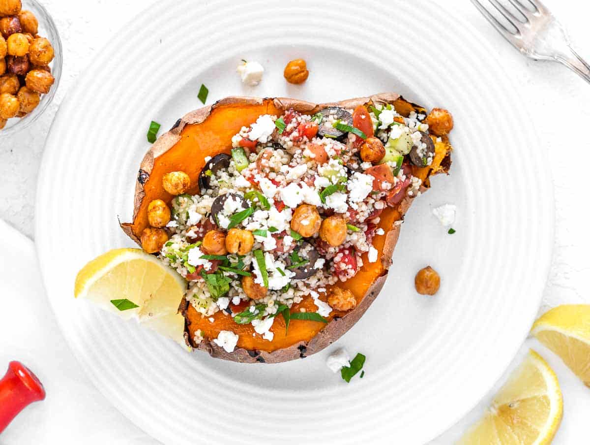 baked sweet potato with couscous, feta, and chickpea