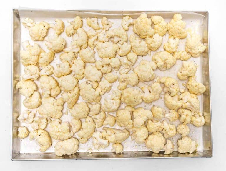 cauliflower florets on a baking sheet