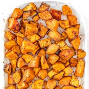 Roasted sweet potatoes on white platter