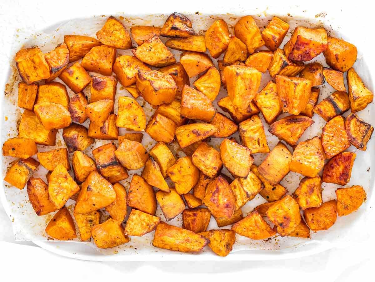 A plate of a wholesome vegetable-based meal with sweet potatoes