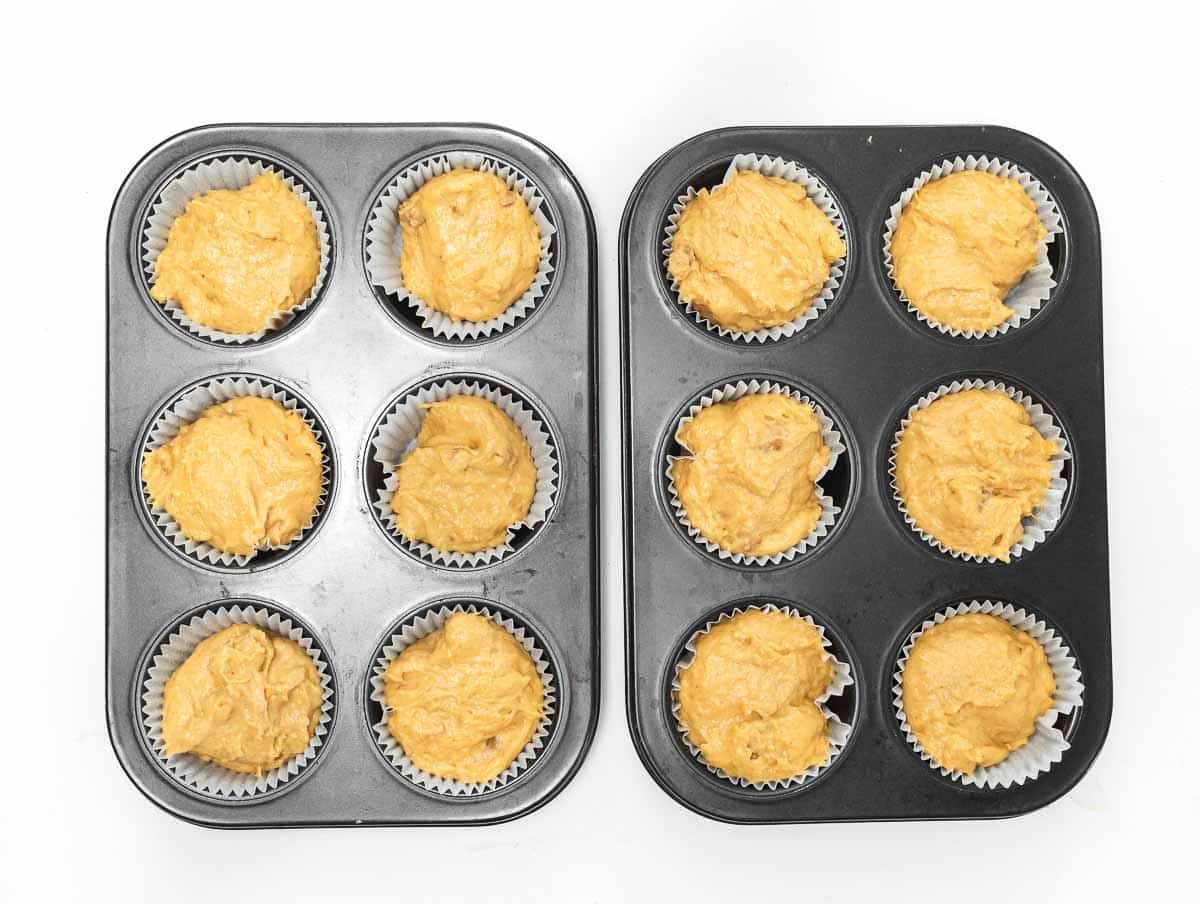 muffin pans with sweet potato muffin batter