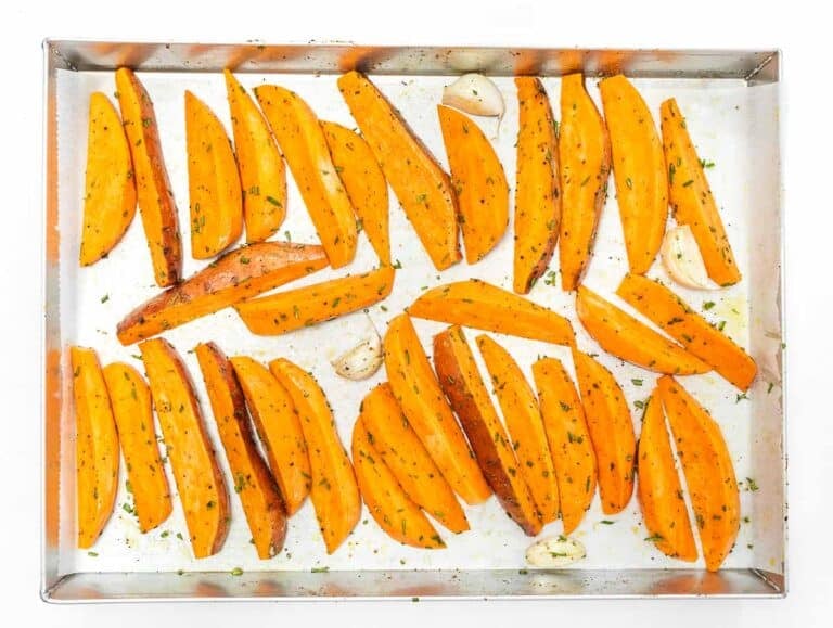 sweet potato wedges arranged on baking sheet