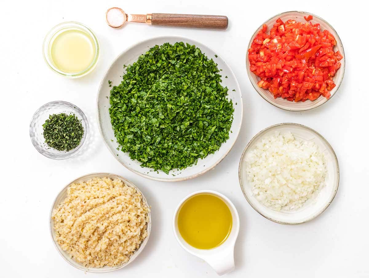 boiled bulgur and chopped ingredients ready to be assembled