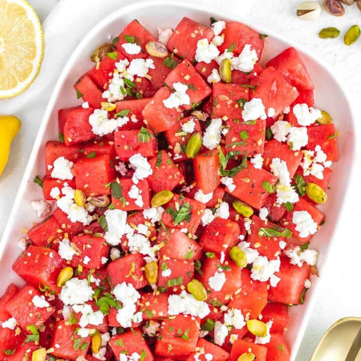 watermelon salad on a serving platter with mint and feta