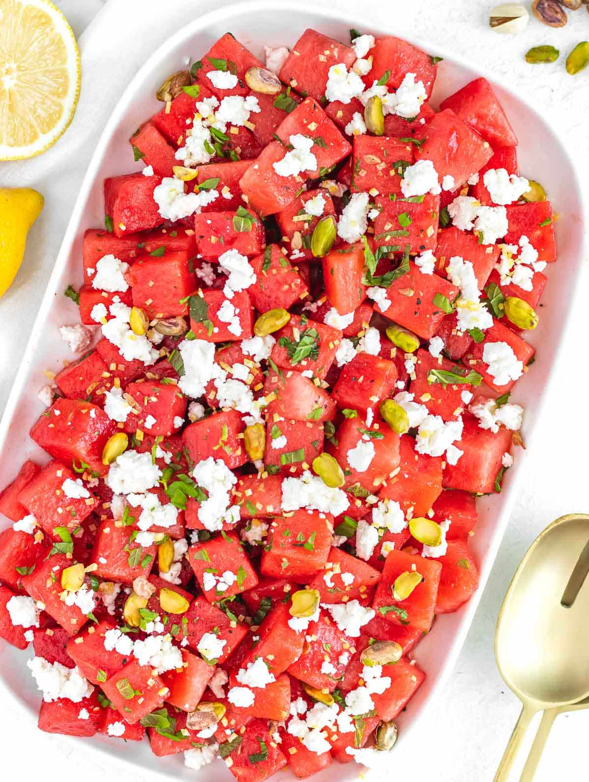 watermelon salad with feta cheese, mint leaves, and lemon