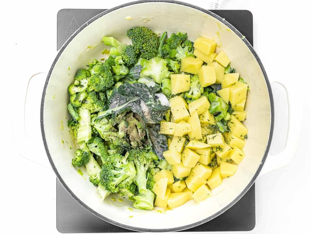 diced potatoes and broccoli in dutch oven