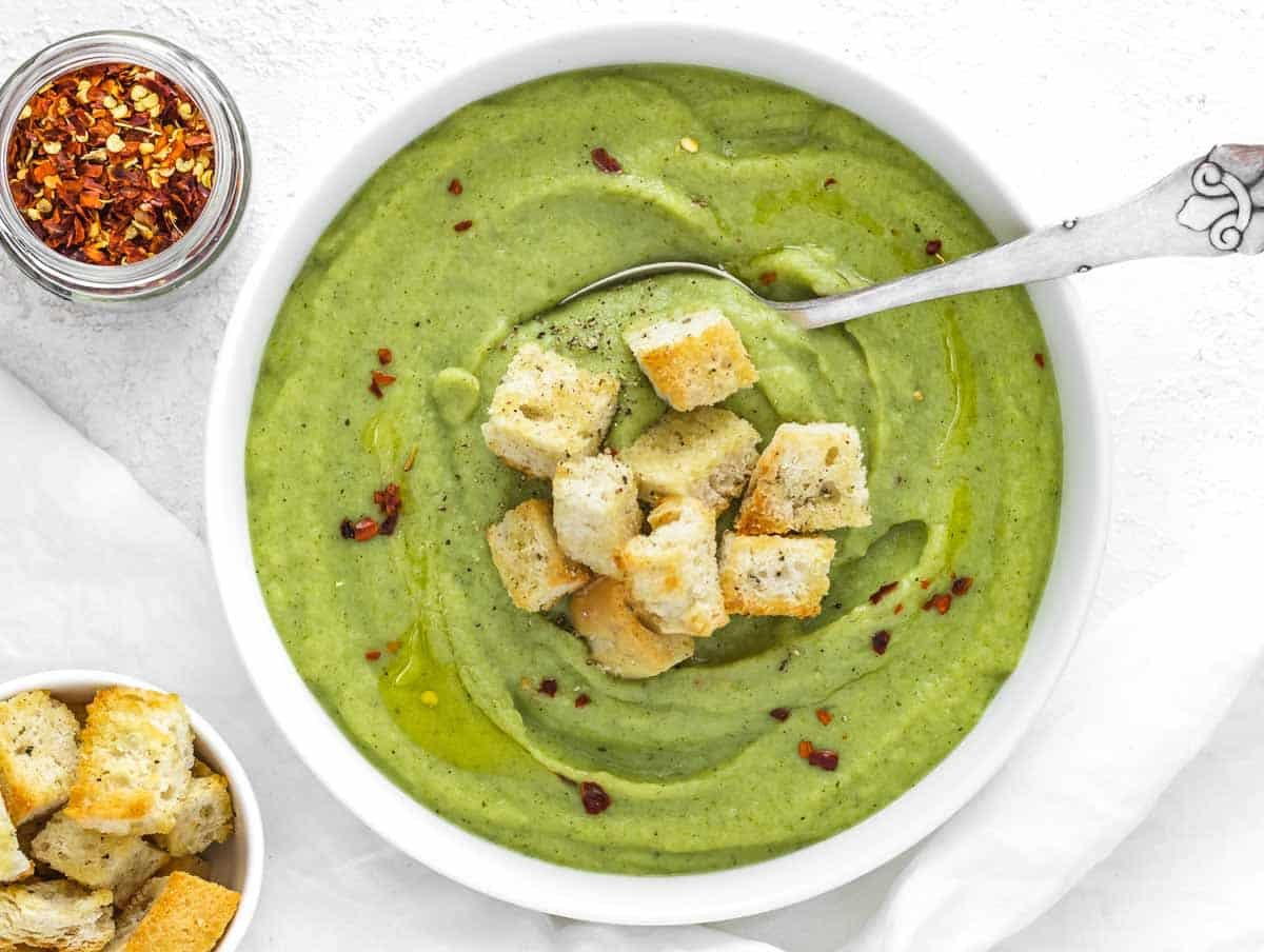 broccoli soup in a bowl with homemade croutons