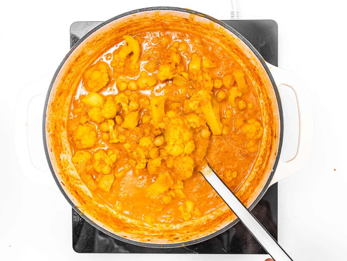Cauliflower curry with a ladle