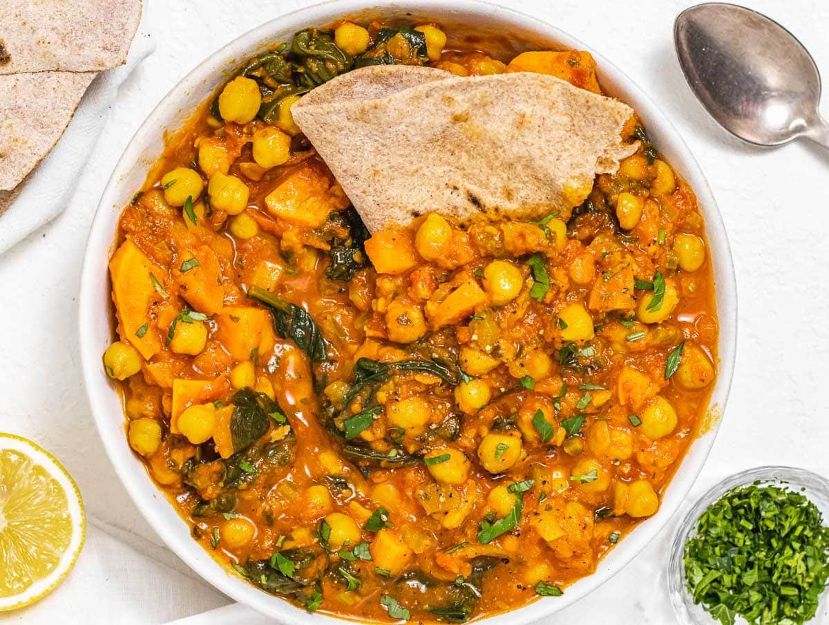 chickpea stew served in a bowl with roti
