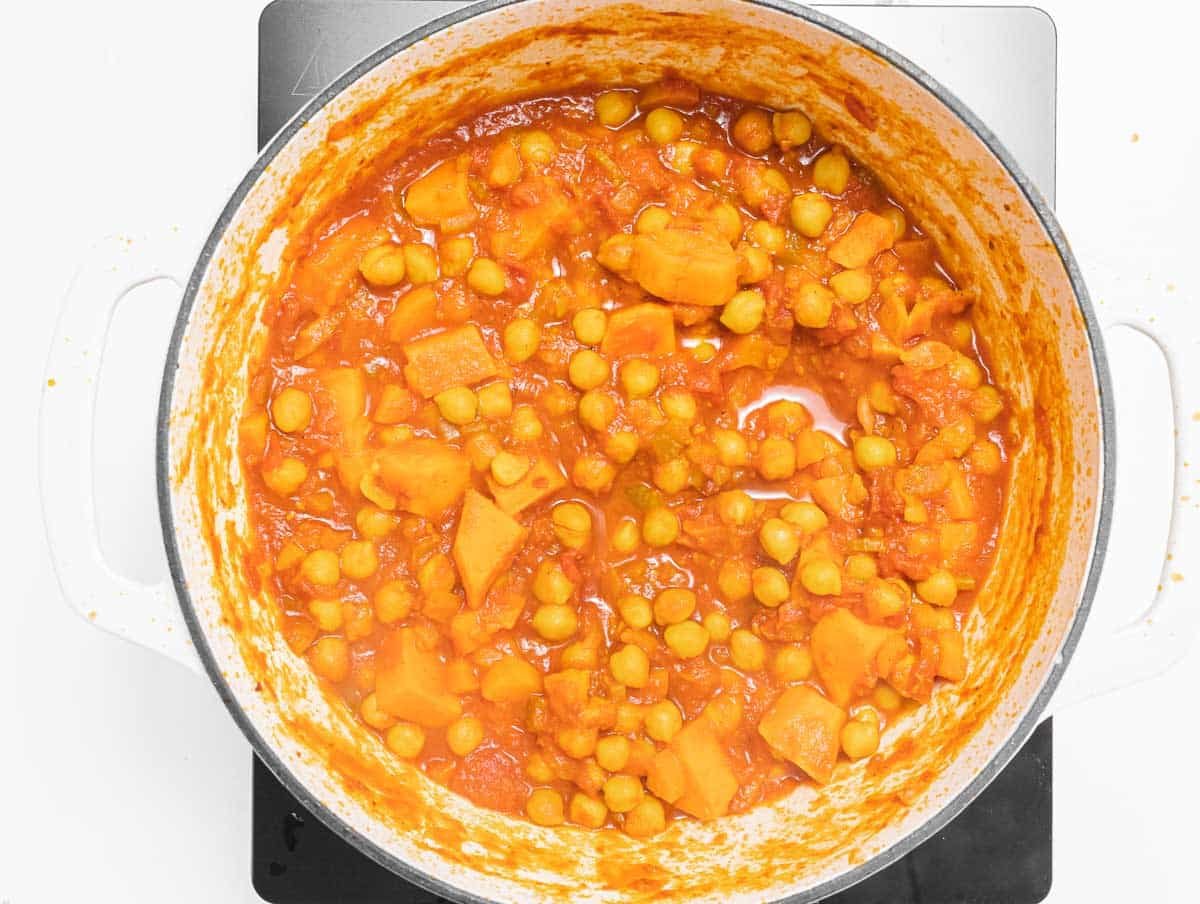 Chickpeas simmering in a skillet