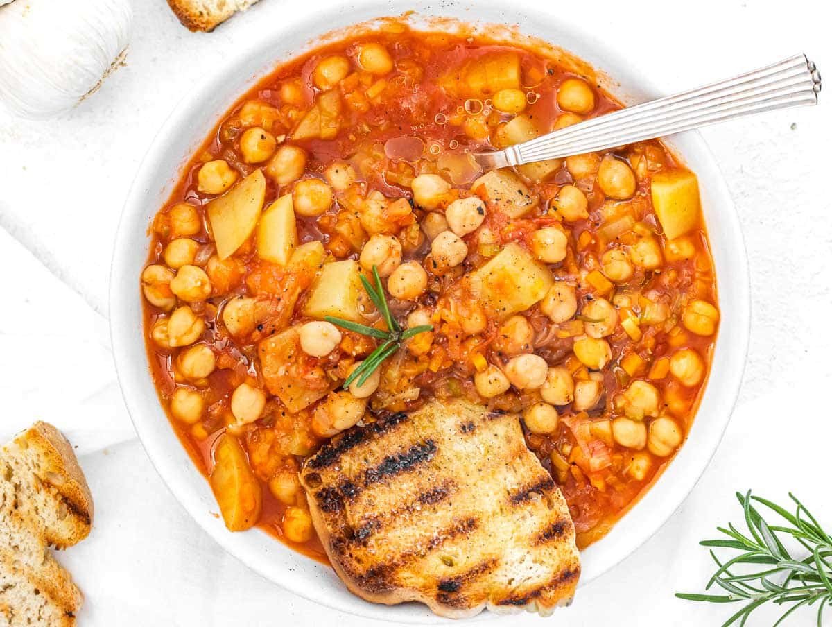 Chickpea soup with spoon and bread