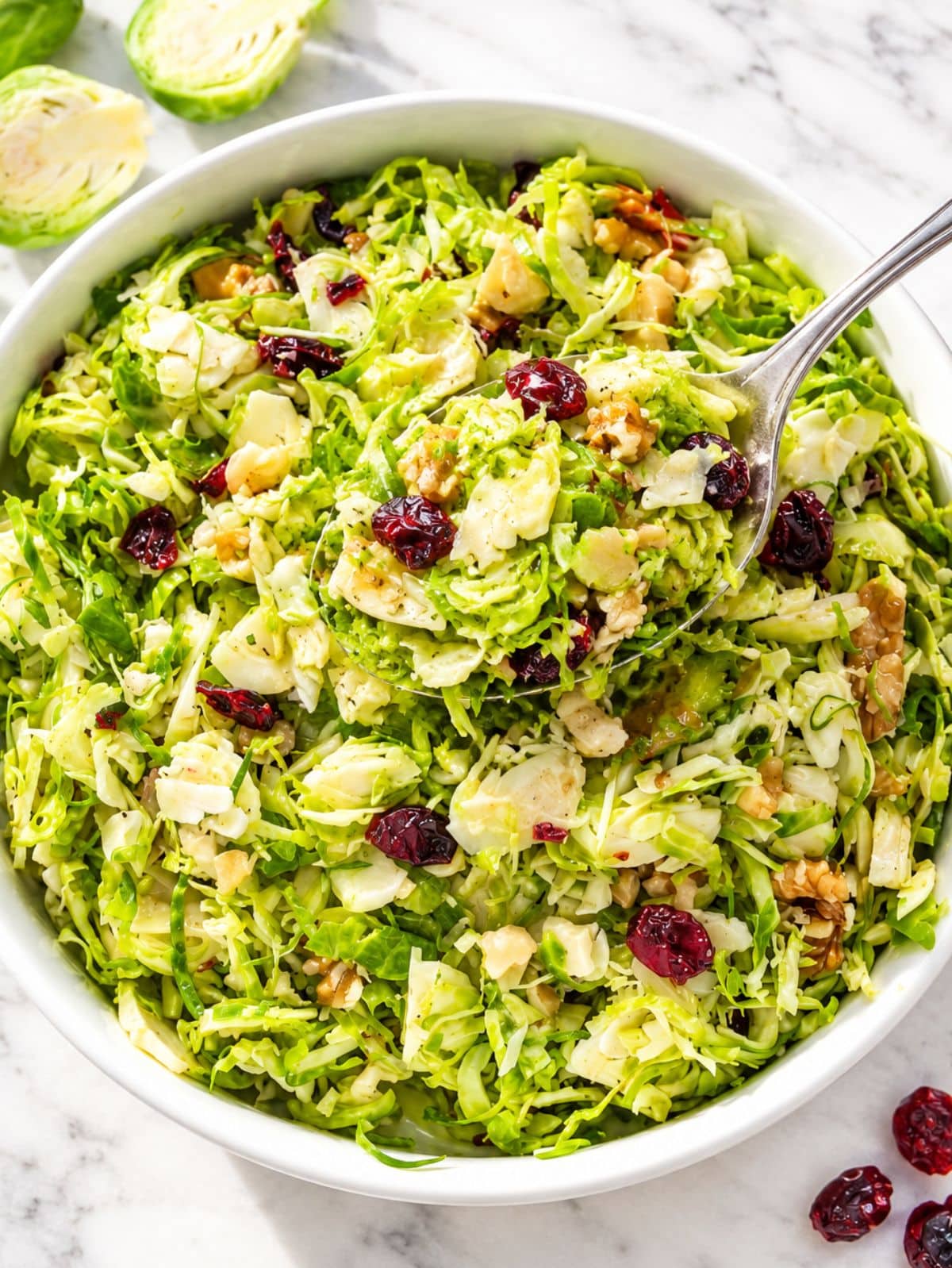 Glossy shaved Brussels sprouts with cranberries and crunchy chopped walnuts.