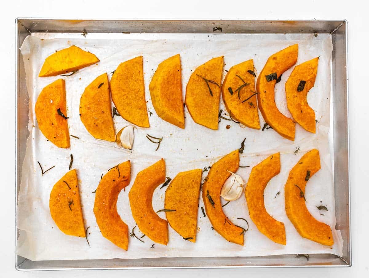 Roasted pumpkin wedges on a tray