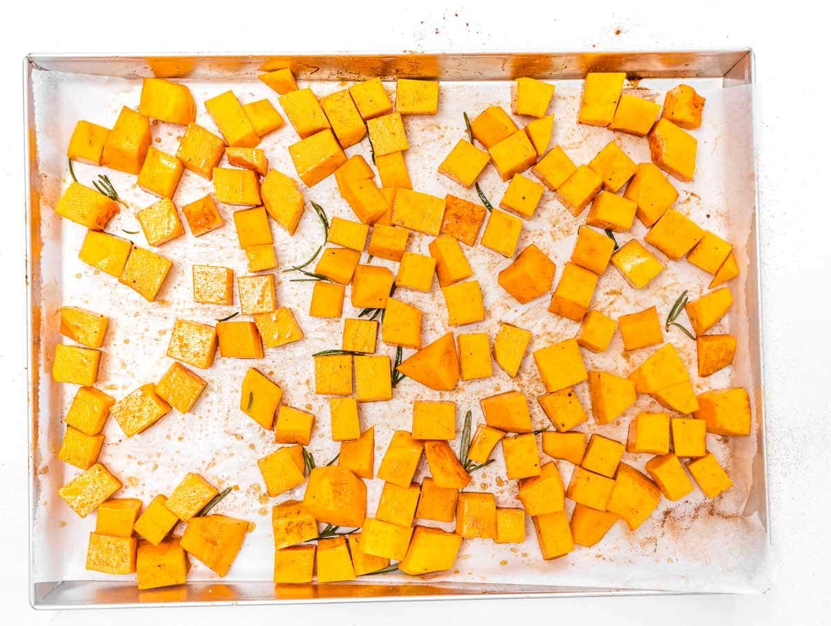 pumpkin cubes on a baking tray