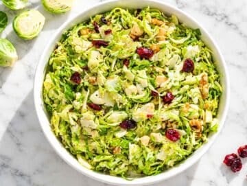 Step 4 Brussels sprouts, cranberries, and walnuts tossed evenly with dressing.