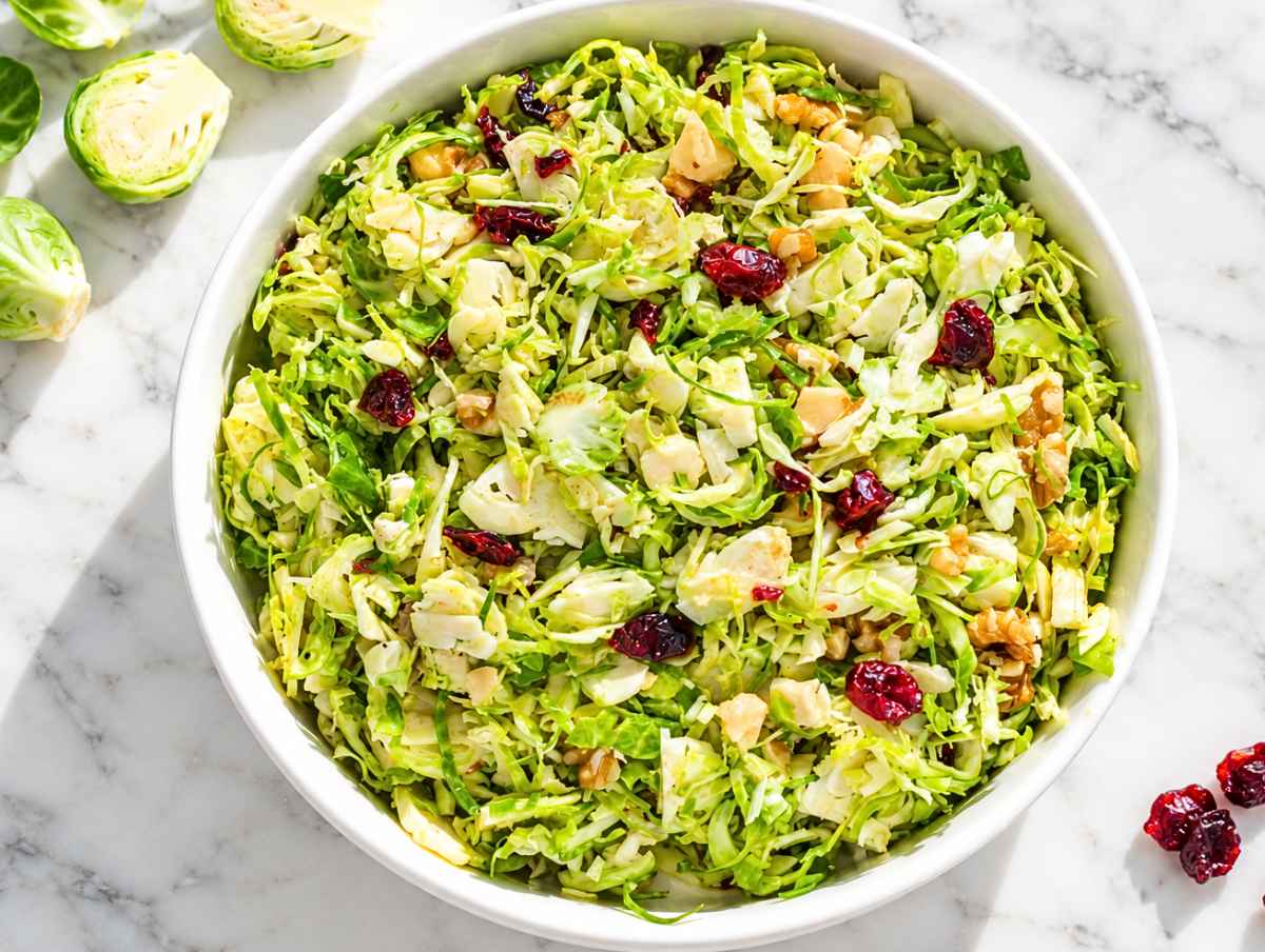 Step 4 Brussels sprouts, cranberries, and walnuts tossed evenly with dressing.