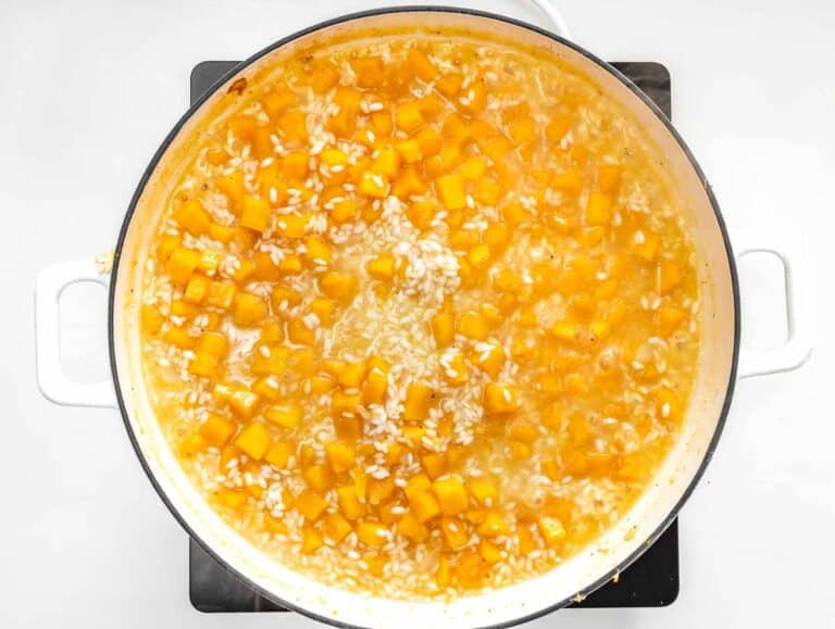 cooking the butternut squash risotto with vegetable broth